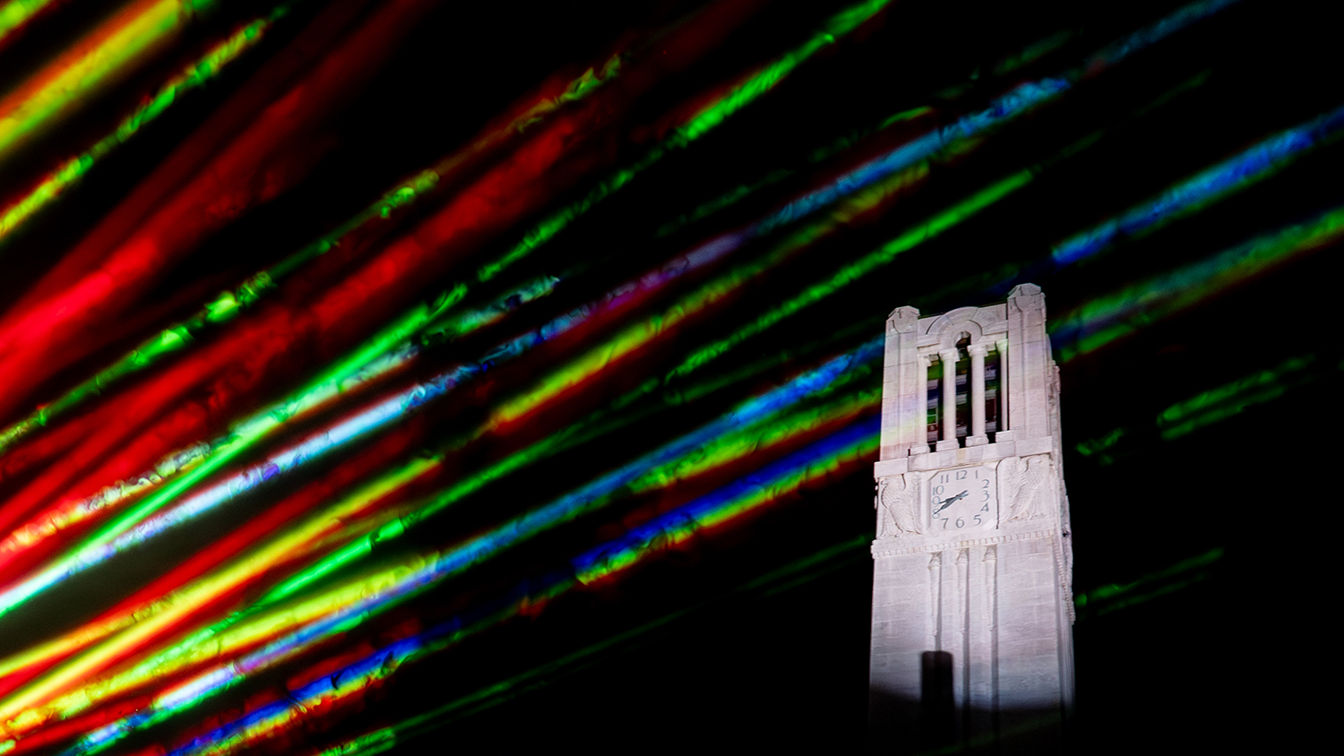 A multi-color laser show at the Belltower during Packapalooza festivities on August 26, 2023.
