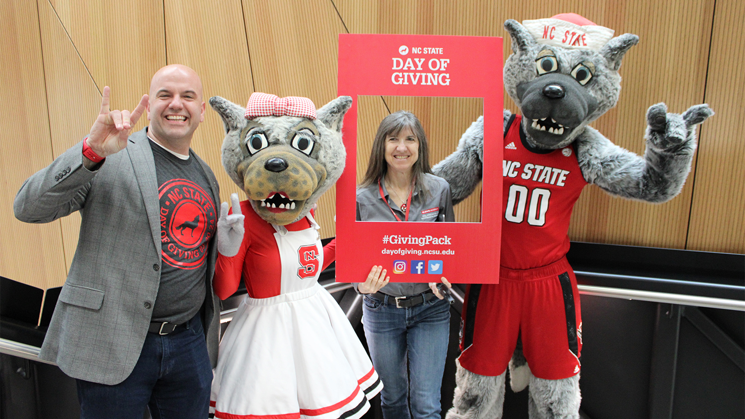 From left, Dean Jim Pfaendtner, Mrs. Wuf, Department Head Jackie Macdonald Gibson and Mr. Wuf during Day of Giving 2024.