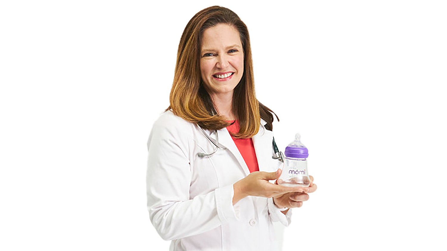 Meg Alden, dressed in a white lab coat, holds the mōmi nipple, a product she developed to assist mothers with bottle-feeding.