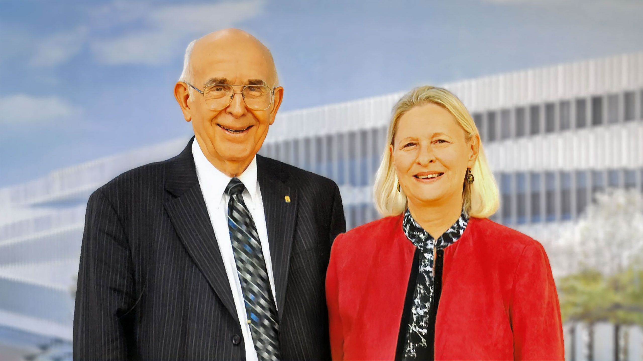 Richard “Dick” Bernhard, left, and his wife Cindy with a view of Fitts-Woolard Hall in the background.