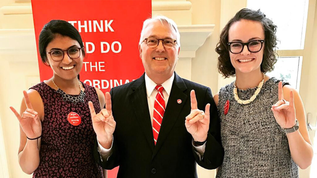 Meredith Martinez, right, with Chancellor Randy Woodson, middle, and fellow student, left.