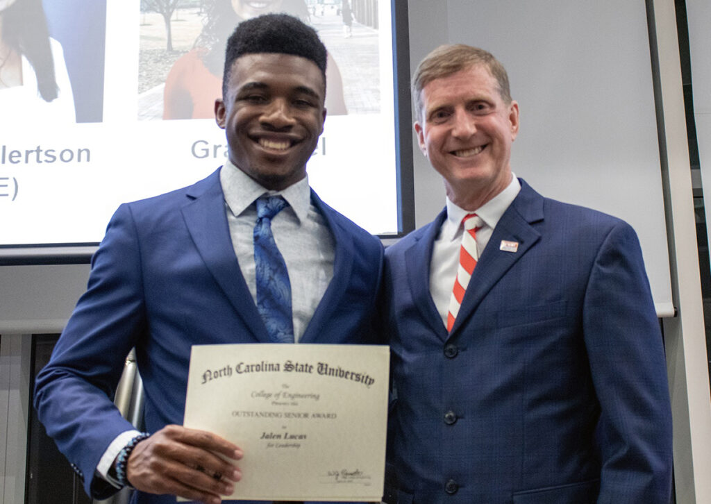 Jalen Lucas, left, receives award from Jerome Lavelle.