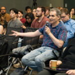 Audience members ask questions during a Sergei Kalinin lecture.