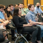 Audience members ask questions during a Sergei Kalinin lecture.