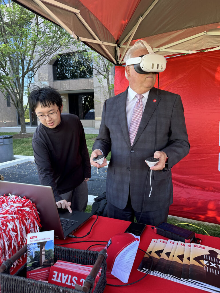 Randy Woodson, the College of Engineering’s outgoing chancellor, tests out a virtual reality simulator.