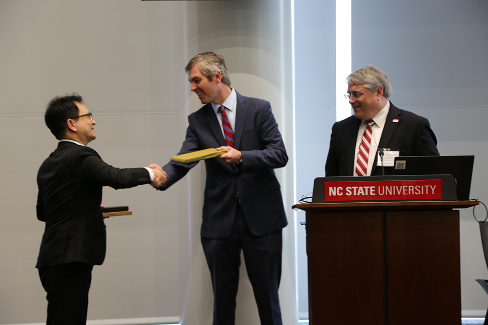 From left: Jason Chang, commercial specialist with the U.S. Commercial Office at the American Institute of Taiwan; Chief Deputy Secretary Jordan Whichard with the NC Department of Commerce; and Chris Frey, associate dean for research and infrastructure at the College of Engineering. Chang gave a business card holder and passport holder. In return, NC State and the Department of Commerce gave Chang a book on traveling in North Carolina.