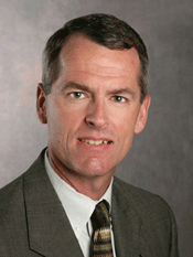 man wearing a brown suit