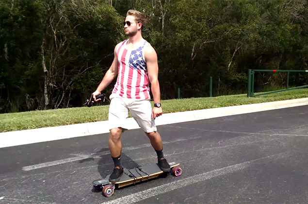 Trey Camp rides his electric longboard.