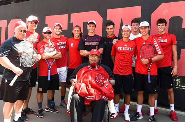 Irwin Holmes poses with the men's team.