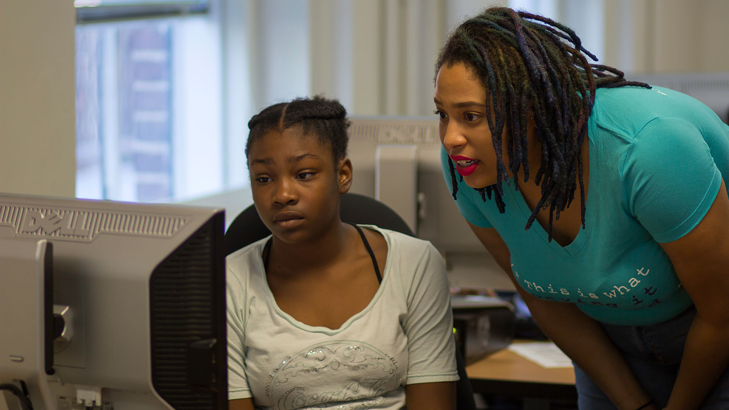 Dr. Brittany Johnson works with a student during the camp.