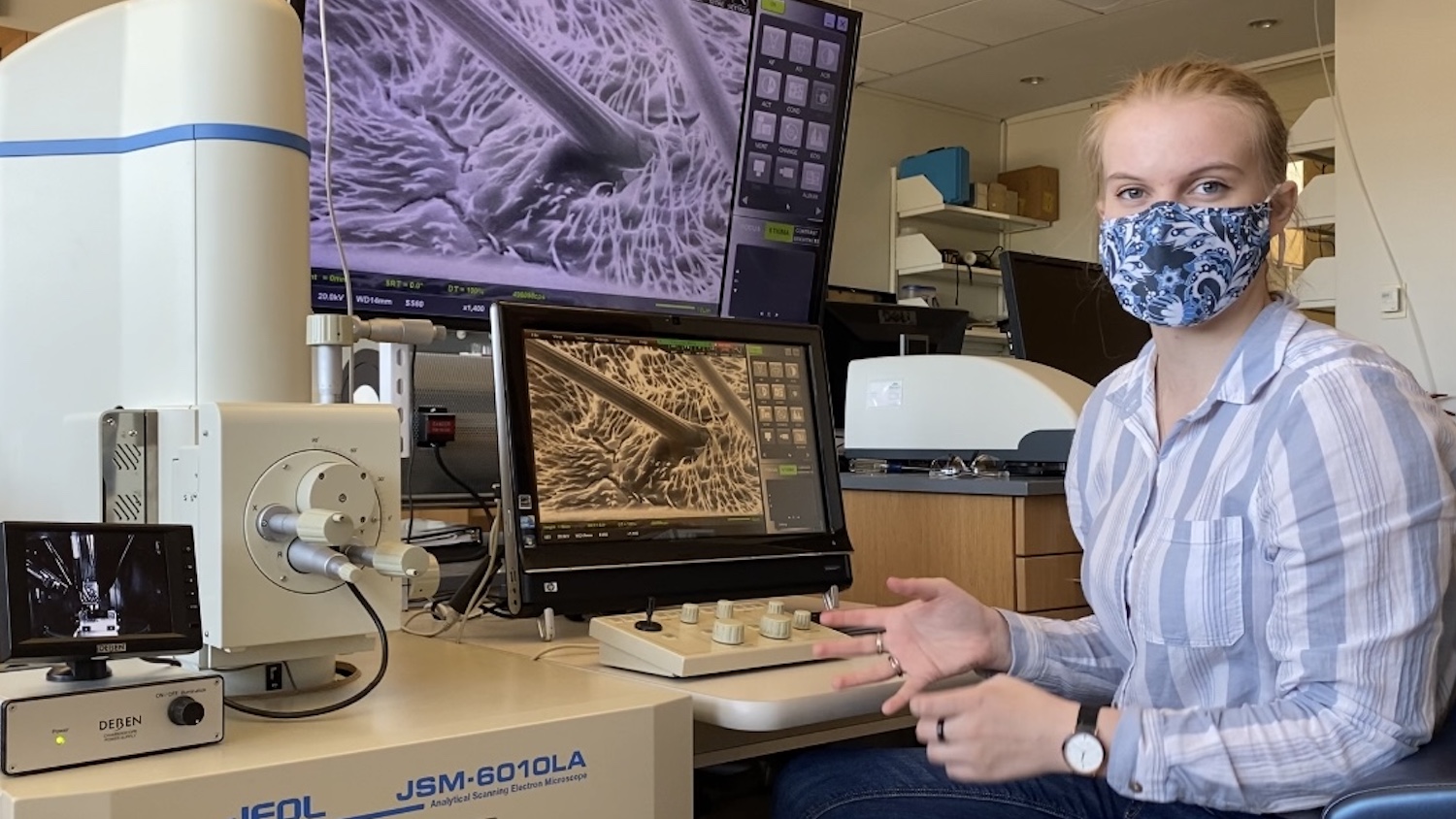 Katie Shaffer wearing face mask while working in lab.