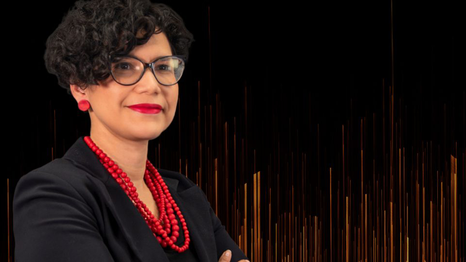 Image of Maria Mayorga superimposed over black background and muted gold computer generated vertical lines.